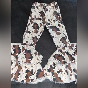 Cow print bell bottoms